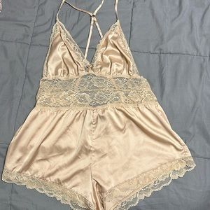 Worn once, didn’t fit correctly. Champagne color. No tears or holes.